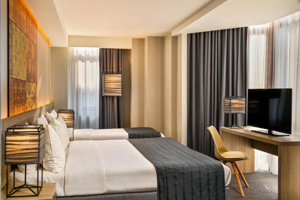Postel nebo postele na pokoji v ubytování Republica Hotel Yerevan