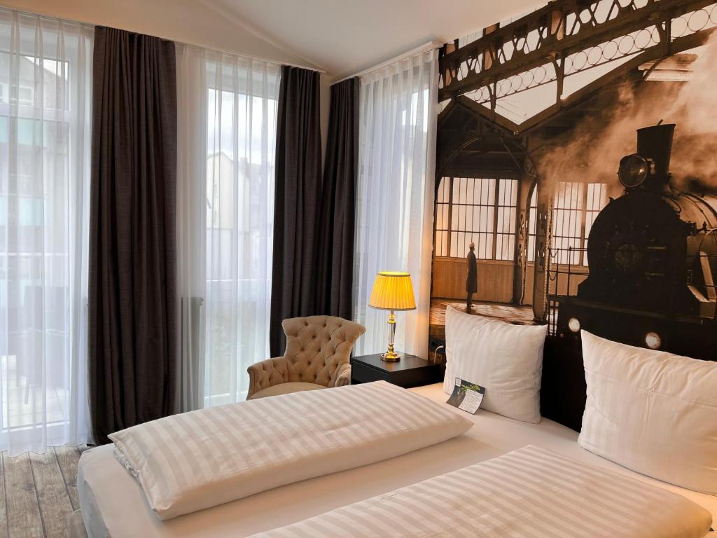 Postel nebo postele na pokoji v ubytování HOTEL CENTRAL FULDA