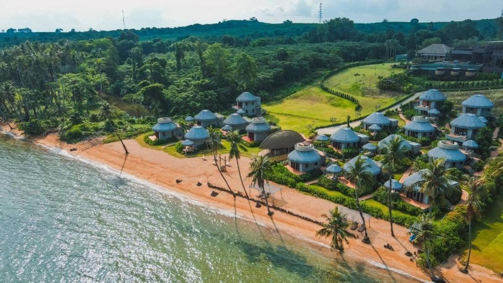 an aerial view of a resort on the beach at The Mak Trat in Ko Mak