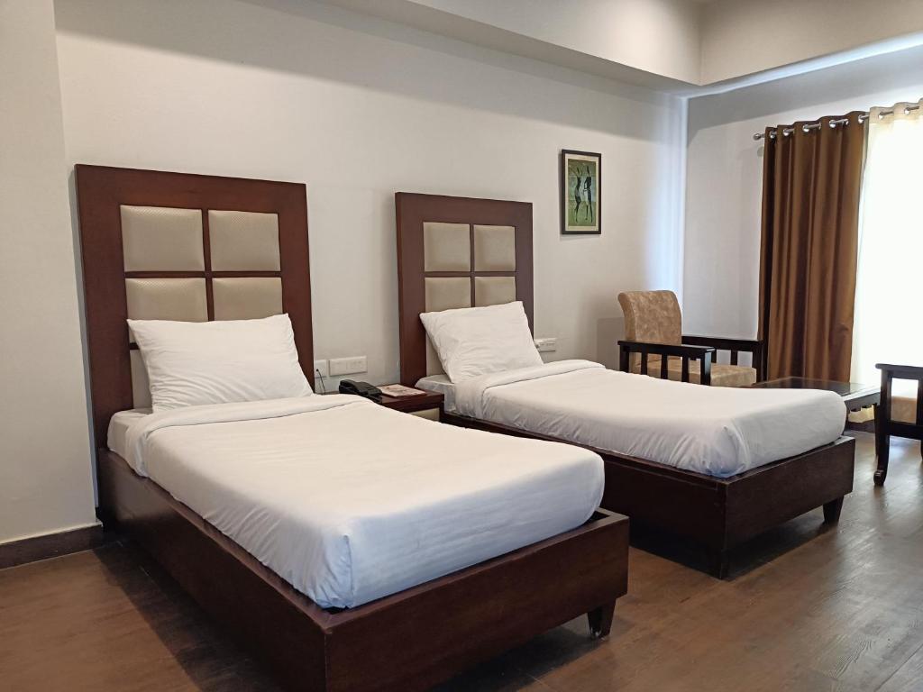 Postel nebo postele na pokoji v ubytování Royal Palm Resort