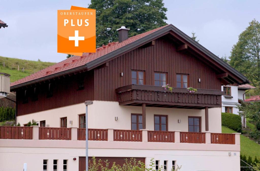a building with a plus sign in front of it at Chalet Edelweiss in Steibis