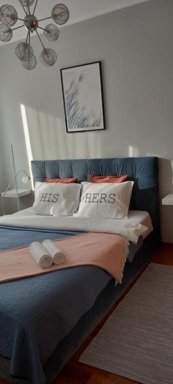 Łóżko lub łóżka w pokoju w obiekcie AnJa Apartment