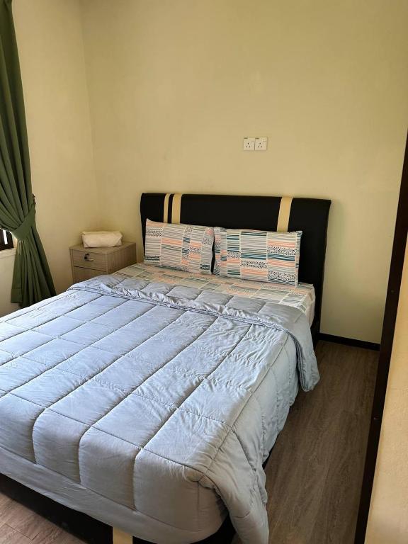 Postel nebo postele na pokoji v ubytování GEORGE ADVENTURE BASE BUNDU TUHAN