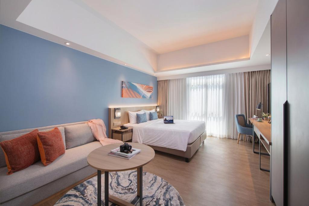 Postel nebo postele na pokoji v ubytování Citadines Roces Quezon City