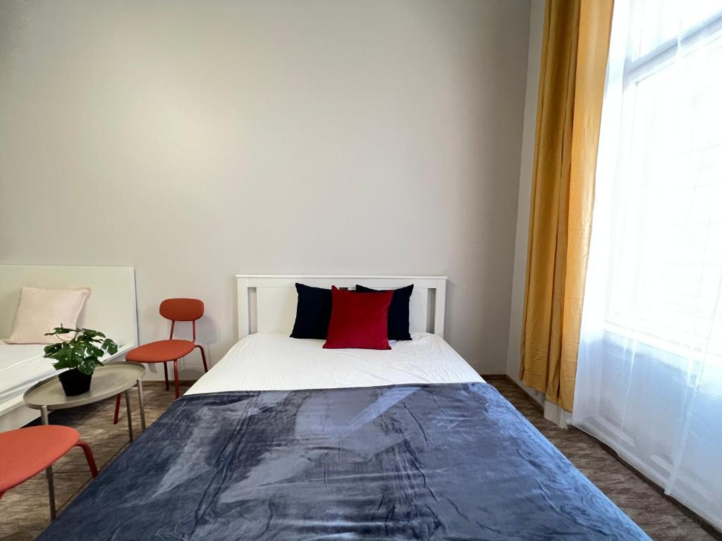 Postel nebo postele na pokoji v ubytování Baross Apartment with Convenience and Style