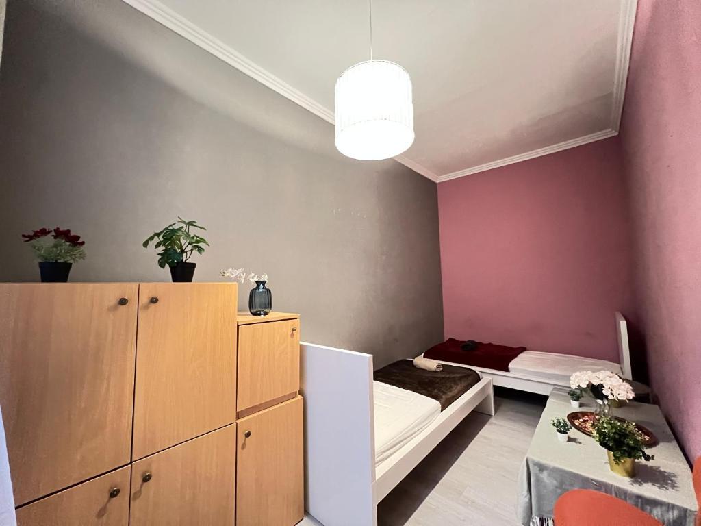 Postel nebo postele na pokoji v ubytování Baross Apartment with Convenience and Style
