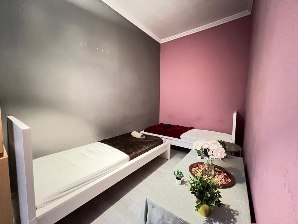 Postel nebo postele na pokoji v ubytování Baross Apartment with Convenience and Style