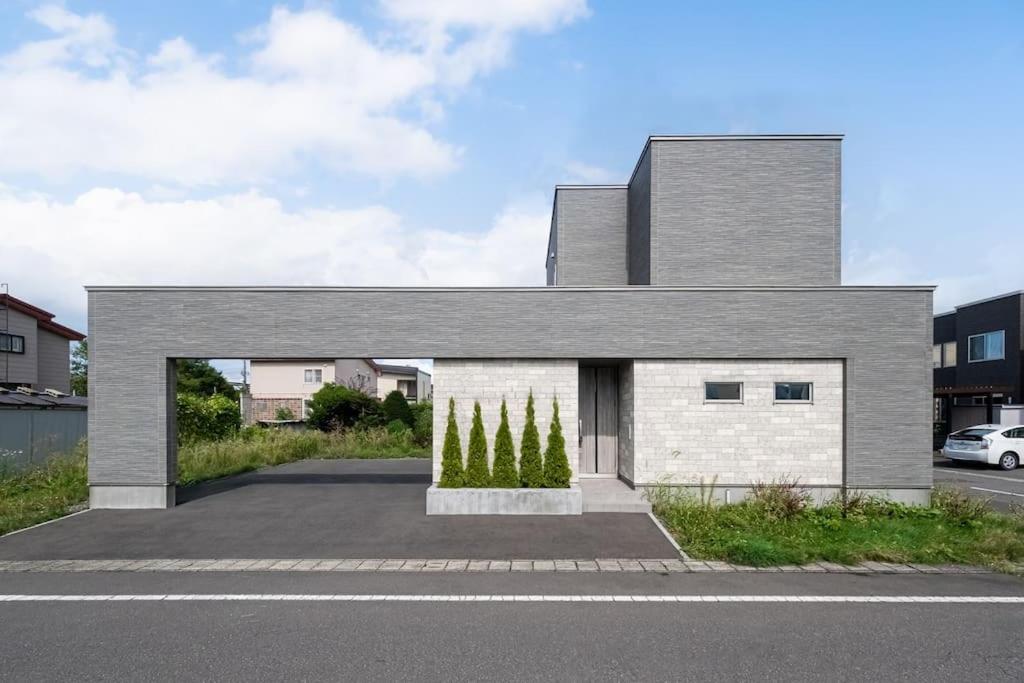 a house with trees on the side of it at THE Prestige in Asahikawa