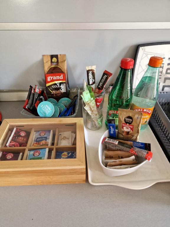 a table with a tray of food and bottles of alcohol at Aleksandar in Pirot