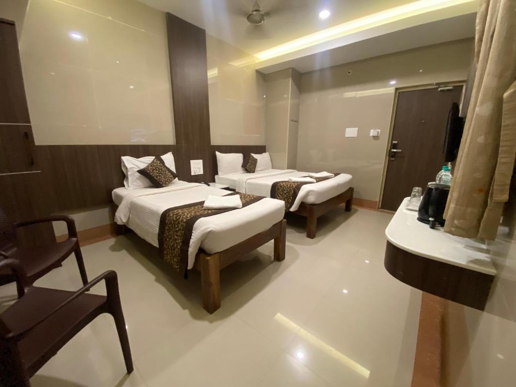 Postel nebo postele na pokoji v ubytování Hotel Sivas Regency