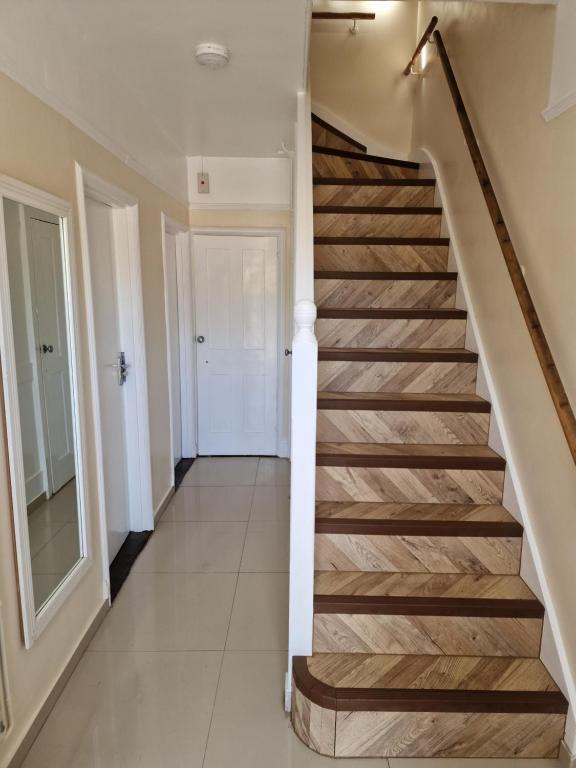 a staircase in a home with wood treads at Marina House in Ipswich