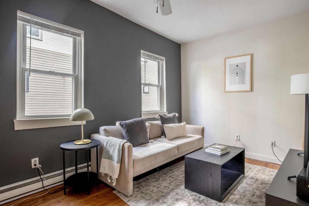 a living room with a couch and a table at South Boston 1br w building wd nr seaport BOS-913 in Boston