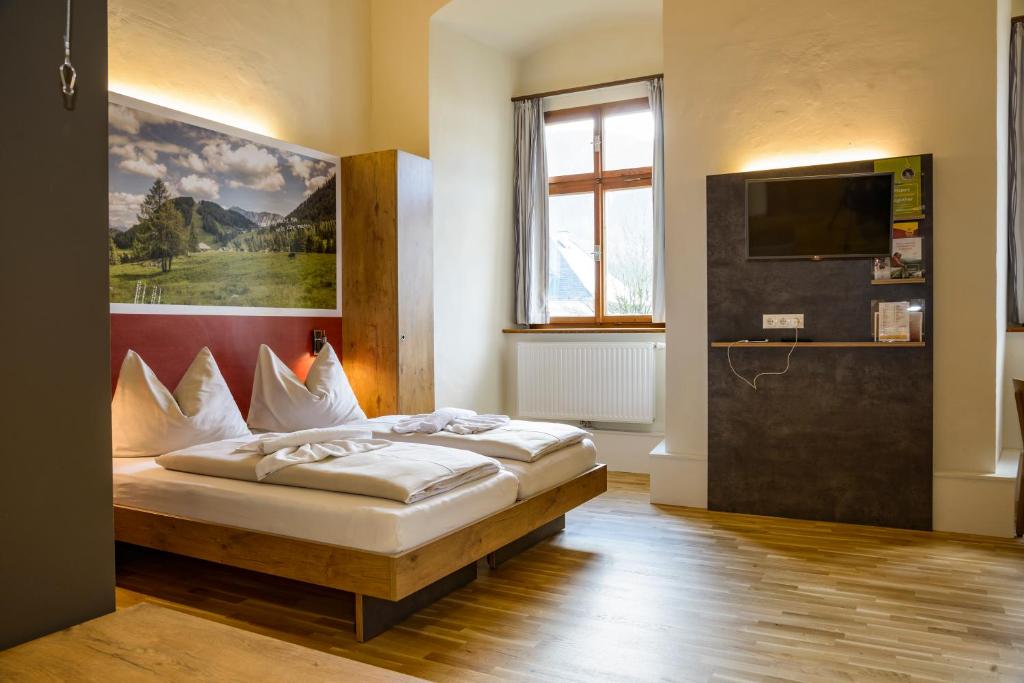 Postel nebo postele na pokoji v ubytování JUFA Hotel Spital am Pyhrn