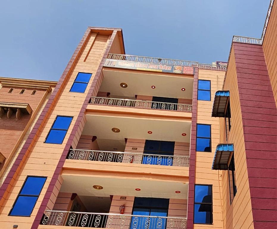 an apartment building with balconies on the side of it at Gopal Hotel and Palace in Jhunjhunūn