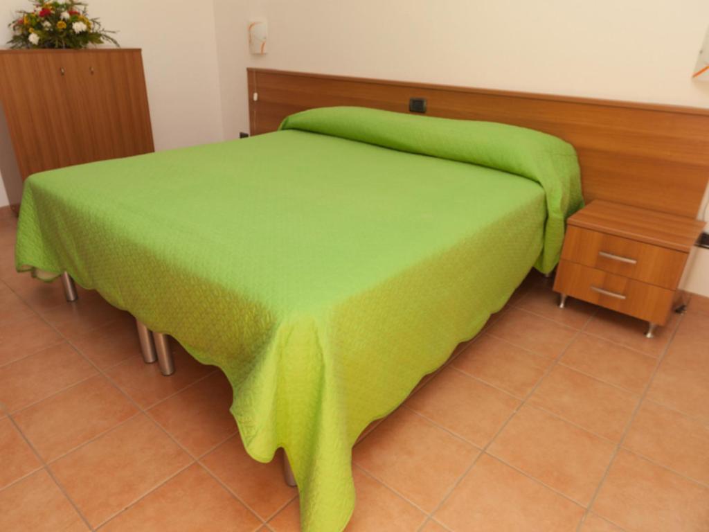 Postel nebo postele na pokoji v ubytování B&B La Collina