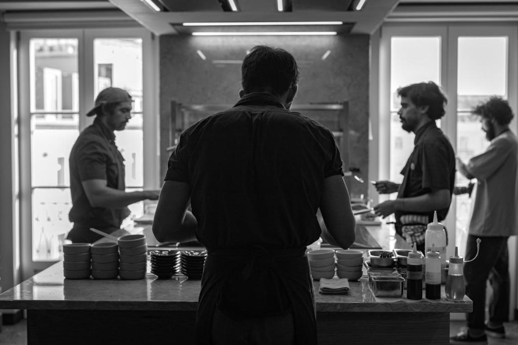 A bright breakfast buffet being prepared by staff.
