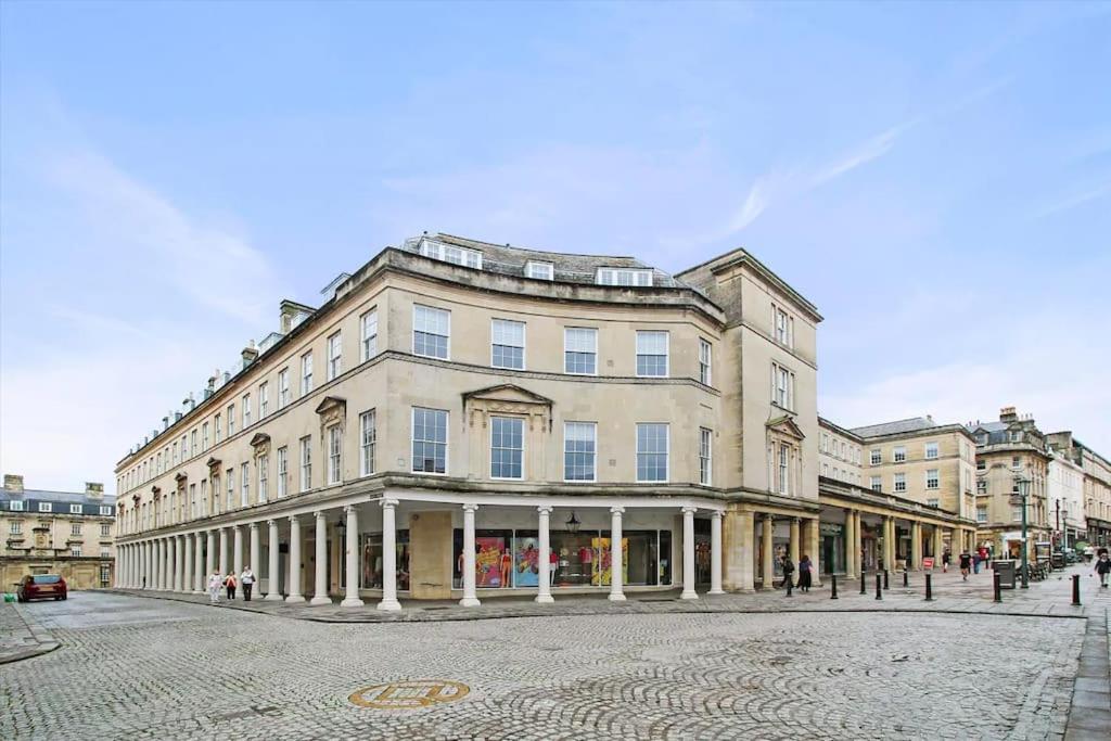 a large building on a street in a city at Haus of Sulis, City Centre Apartment with Lift Access in Bath