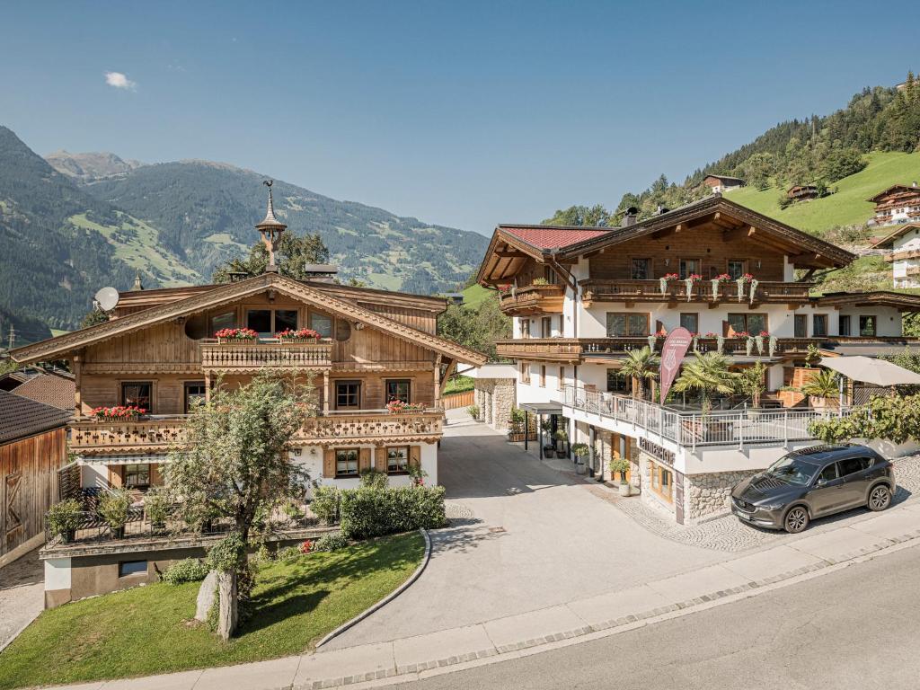 an overhead view of a building with a car parked in front at Leitnerhof in Ramsau im Zillertal