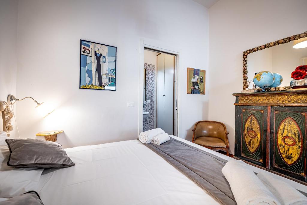 Postel nebo postele na pokoji v ubytování Roommo Cimabue