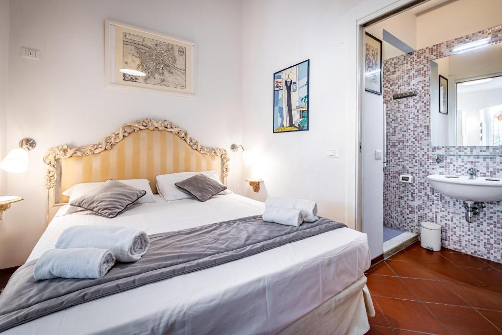 Postel nebo postele na pokoji v ubytování Roommo Cimabue