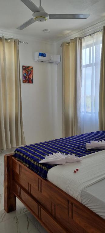 Postel nebo postele na pokoji v ubytování Terry's Villa Nungwi