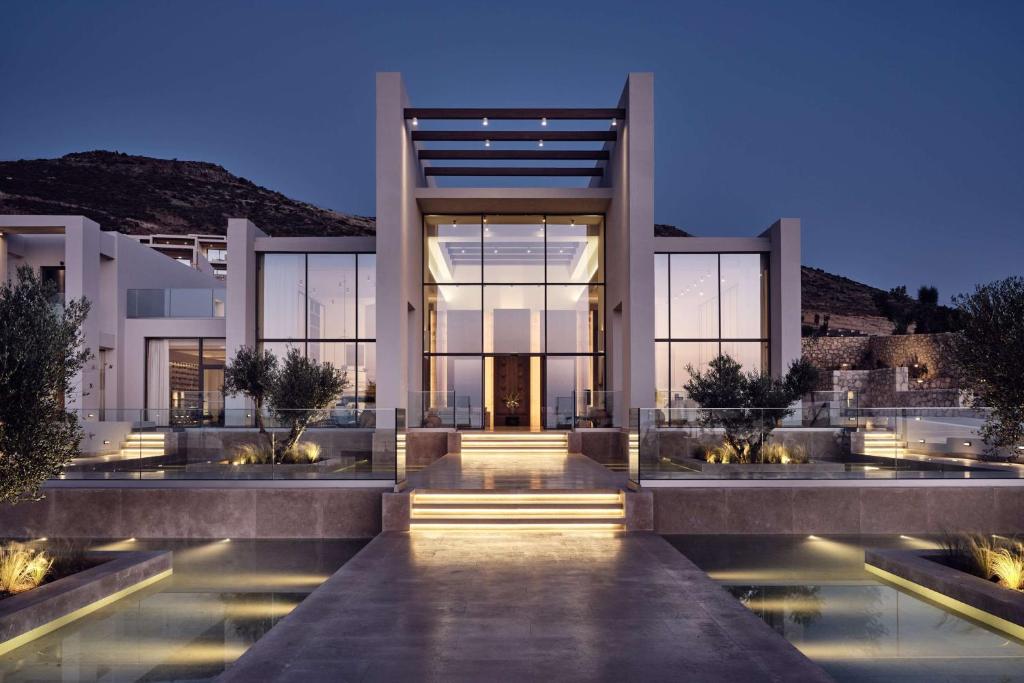 a rendering of a villa at night at The Royal Senses Resort & Spa Crete, Curio Collection by Hilton in Panormos Rethymno