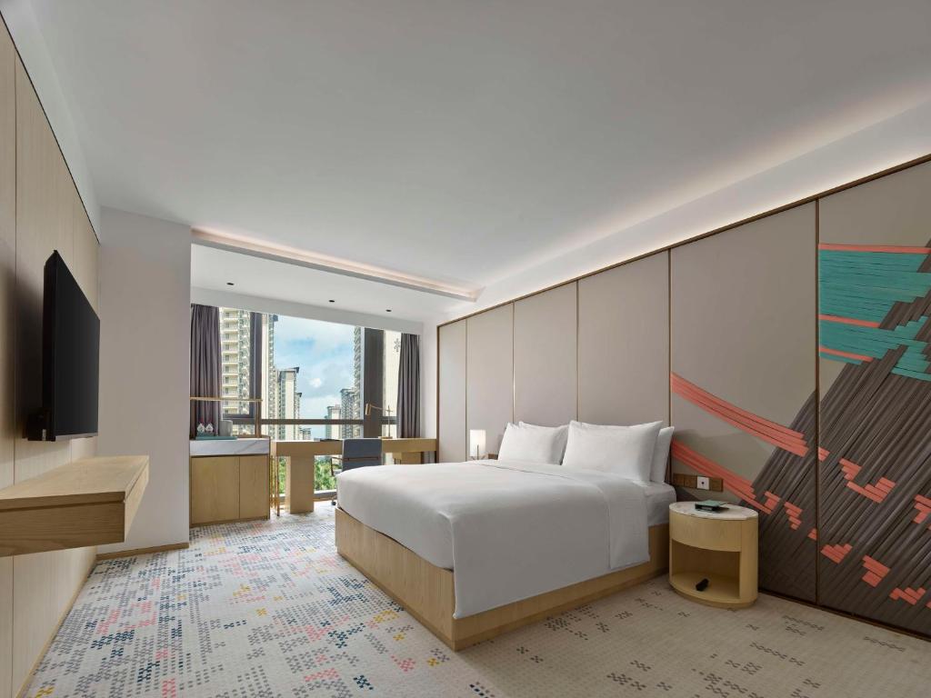 Postel nebo postele na pokoji v ubytování Doubletree By Hilton Nanning Wuxiang