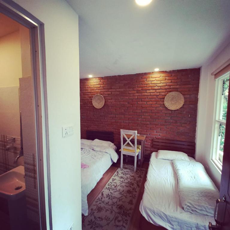 Postel nebo postele na pokoji v ubytování KAJI HOME