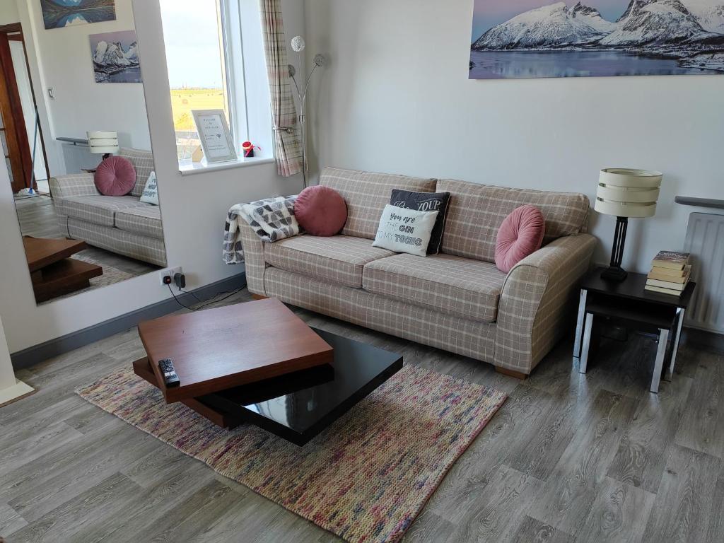 a living room with a couch and a coffee table at Westview in Buckie