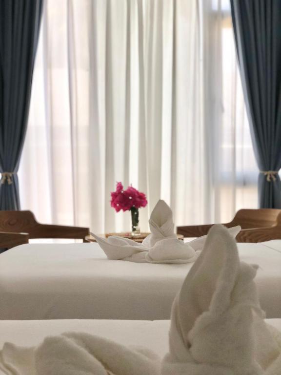 Postel nebo postele na pokoji v ubytování Fun Hotel