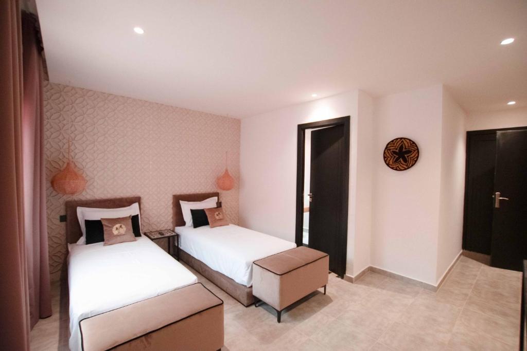 Postel nebo postele na pokoji v ubytování Riad La Petite Majorelle
