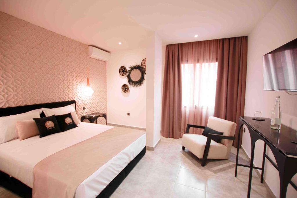 Postel nebo postele na pokoji v ubytování Riad La Petite Majorelle