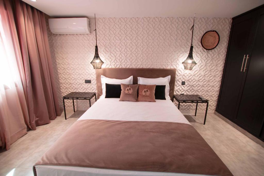 Postel nebo postele na pokoji v ubytování Riad La Petite Majorelle