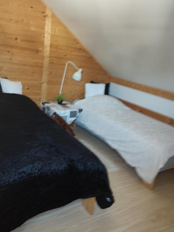 Posteľ alebo postele v izbe v ubytovaní Apartament 4 plus 1 w Karkonoszach