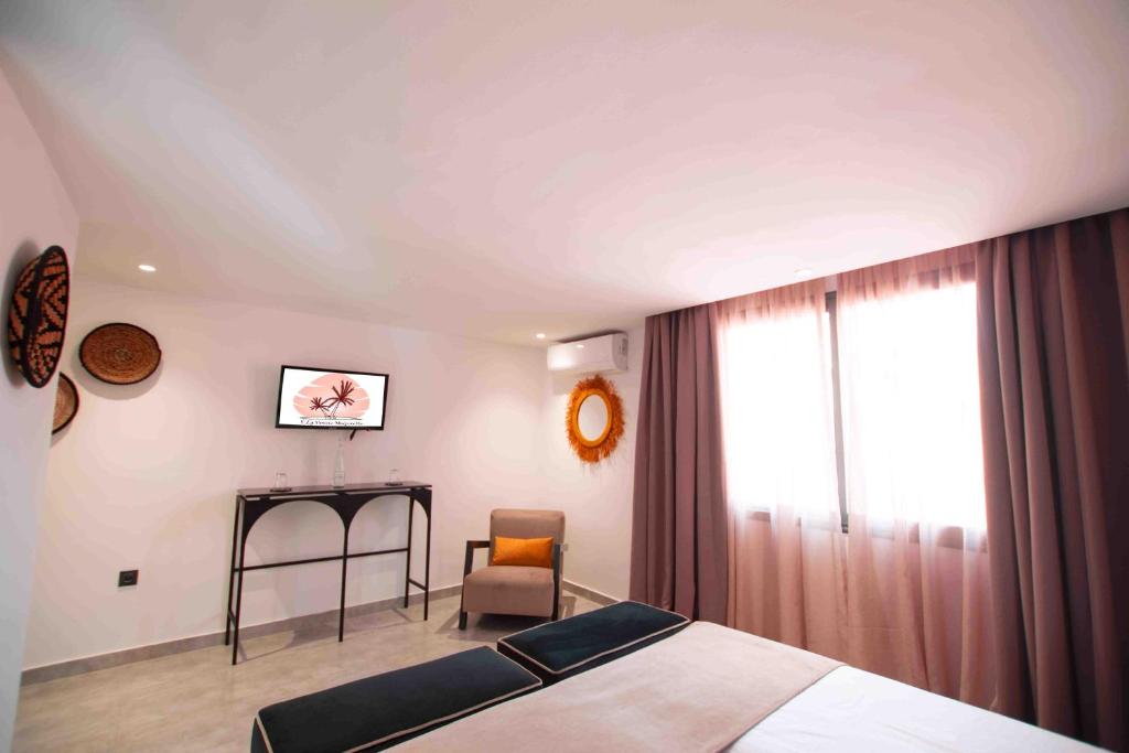Postel nebo postele na pokoji v ubytování Riad La Petite Majorelle