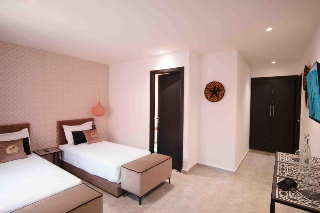 Postel nebo postele na pokoji v ubytování Riad La Petite Majorelle