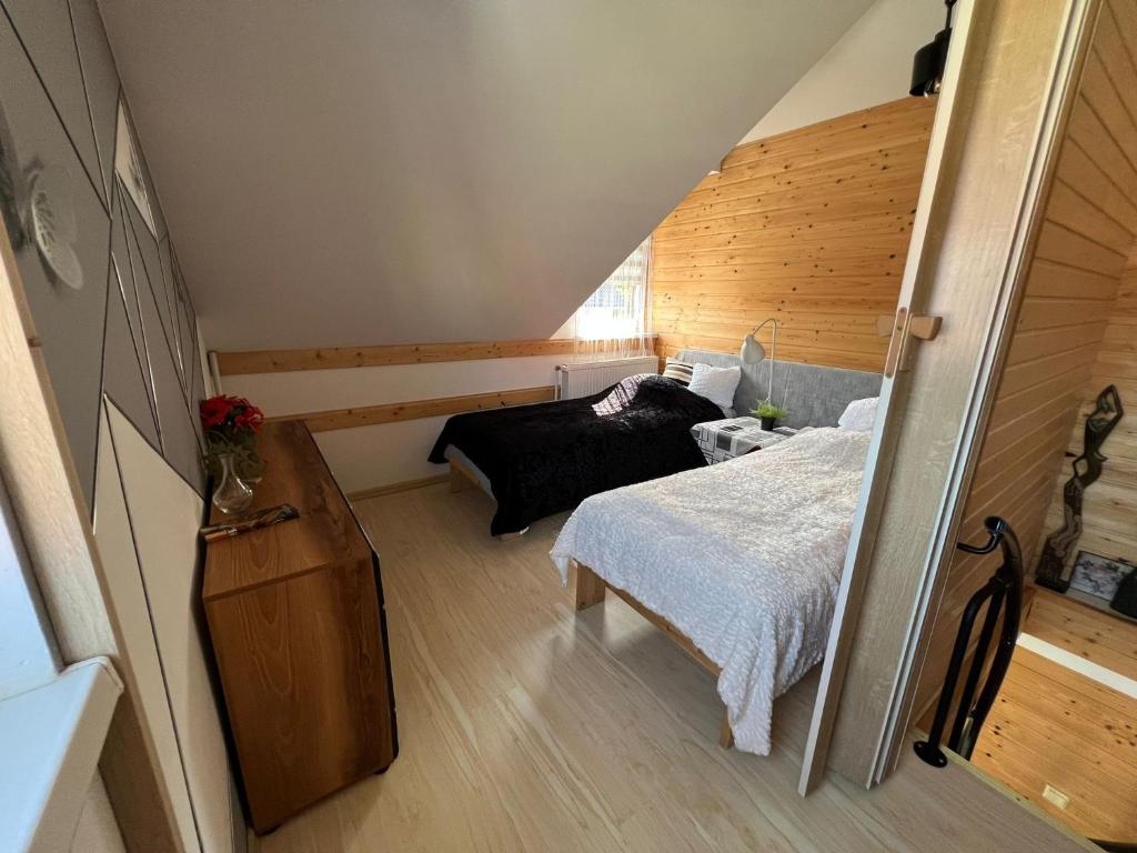 Posteľ alebo postele v izbe v ubytovaní Apartament 4 plus 1 w Karkonoszach