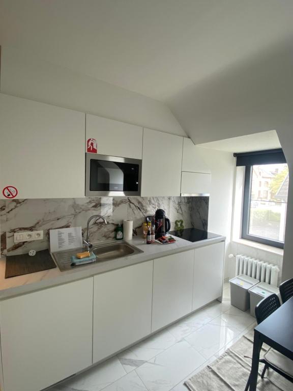 Kuchyň nebo kuchyňský kout v ubytování Nummer 151 villastudios