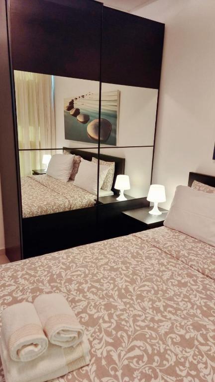 Postel nebo postele na pokoji v ubytování Suite Paradise - D111