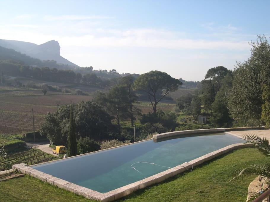 a swimming pool in the middle of a field at logement entier atypique à Cassis in Cassis