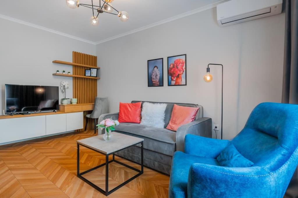 a living room with a couch and a table at Lozenets Apartment in Sofia