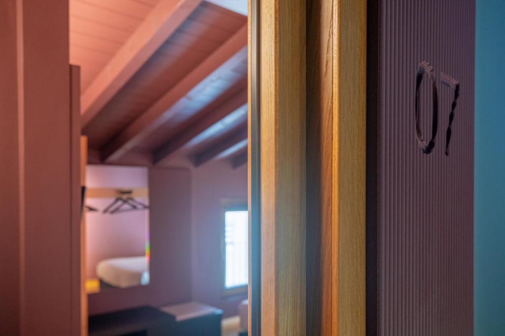 Postel nebo postele na pokoji v ubytování Albergo La Braseria
