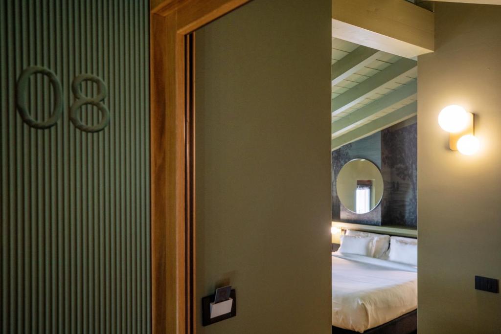 Postel nebo postele na pokoji v ubytování Albergo La Braseria
