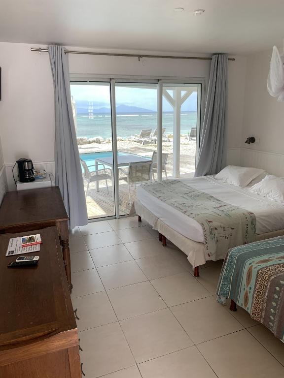 Postel nebo postele na pokoji v ubytování Coco Beach Marie-Galante