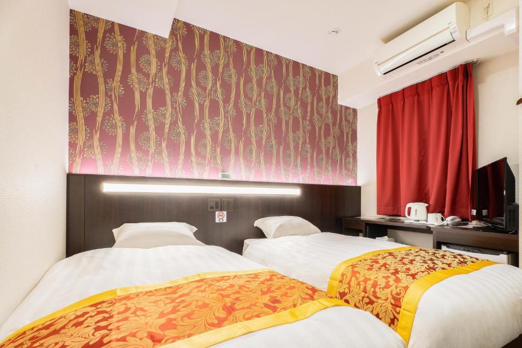 Postel nebo postele na pokoji v ubytování Pearl Spring116 hotel