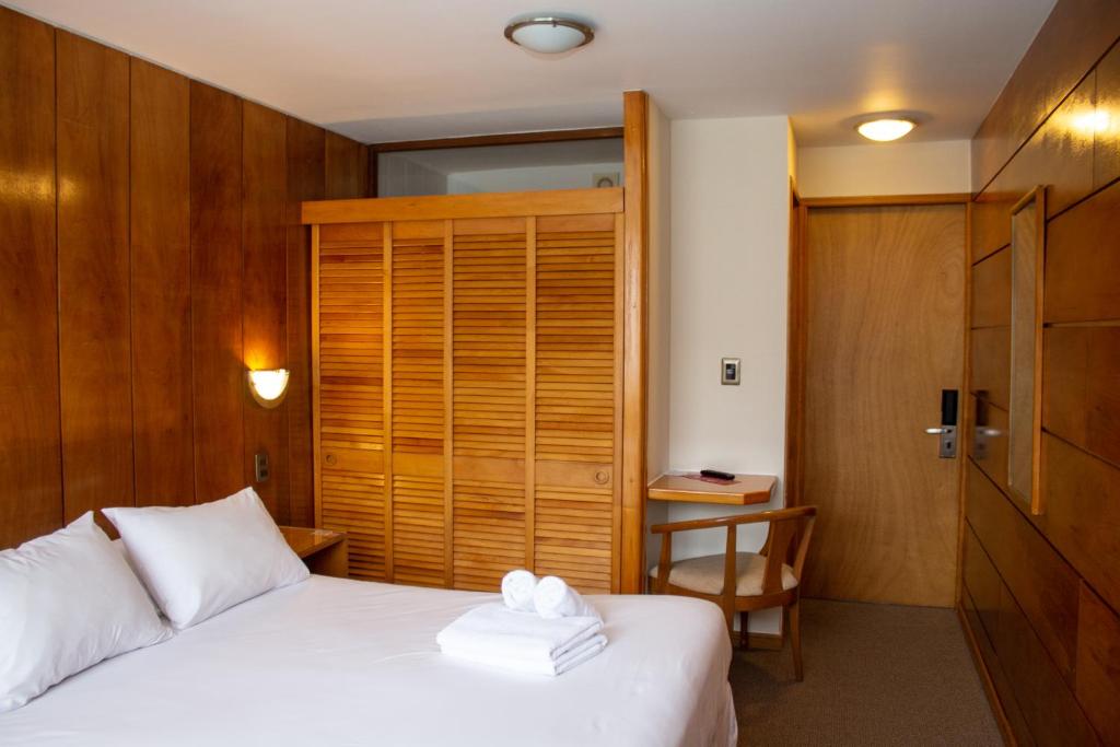 Postel nebo postele na pokoji v ubytování Hotel Germania