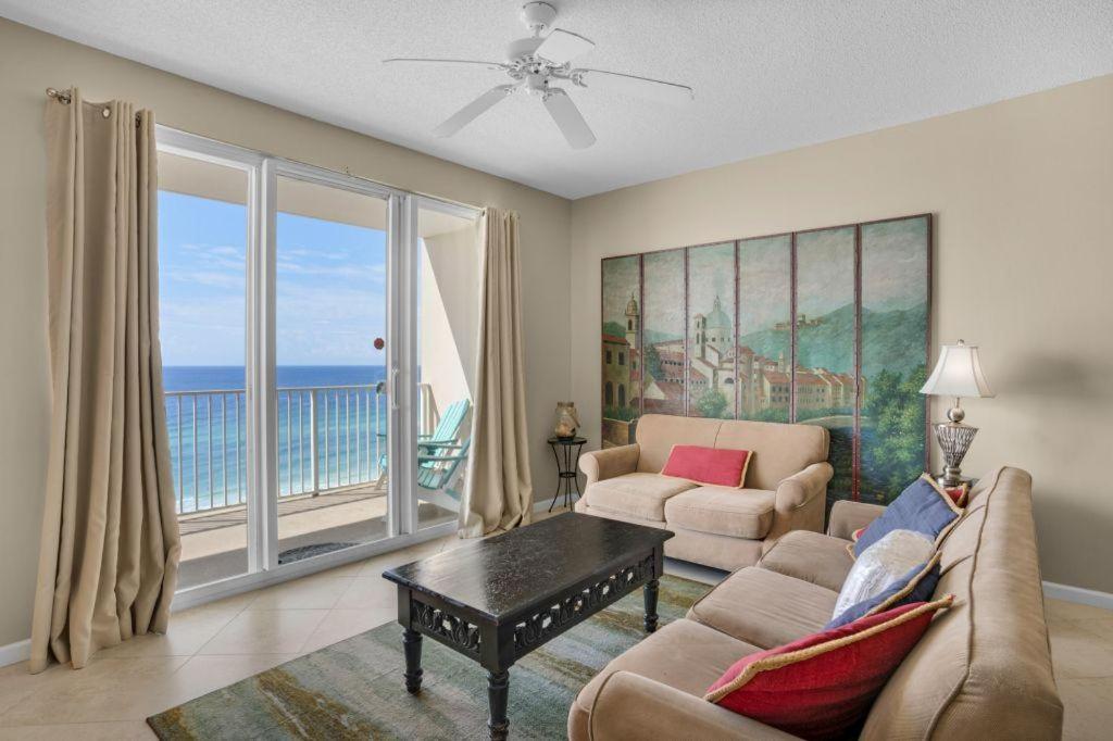a living room with a view of the ocean at Majestic Sun 904B in Destin