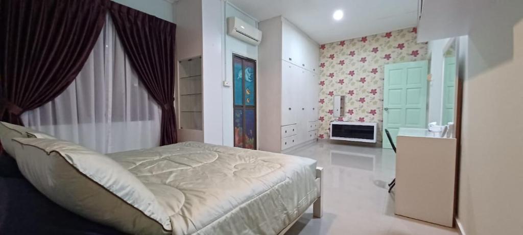 Ліжко або ліжка в номері JMKT Homestay @ Bandar Seri Alam