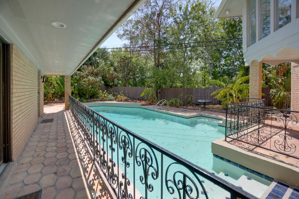 a swimming pool on a balcony of a house at Houston Home near Medical Center and NRG Stadium! in Houston
