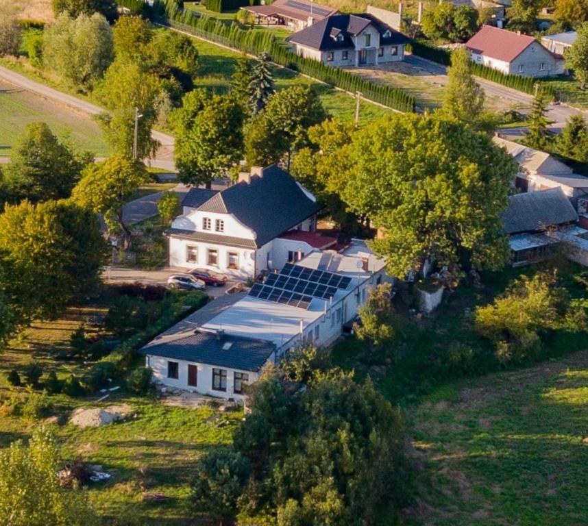 an aerial view of a house with solar panels on it at Stara Szkoła w Weremowicach in Weremowice